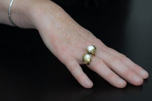 Hand modelling double pearl brass ring.