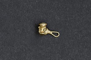 Small Brass Jewellery Charm of hand holding cup.