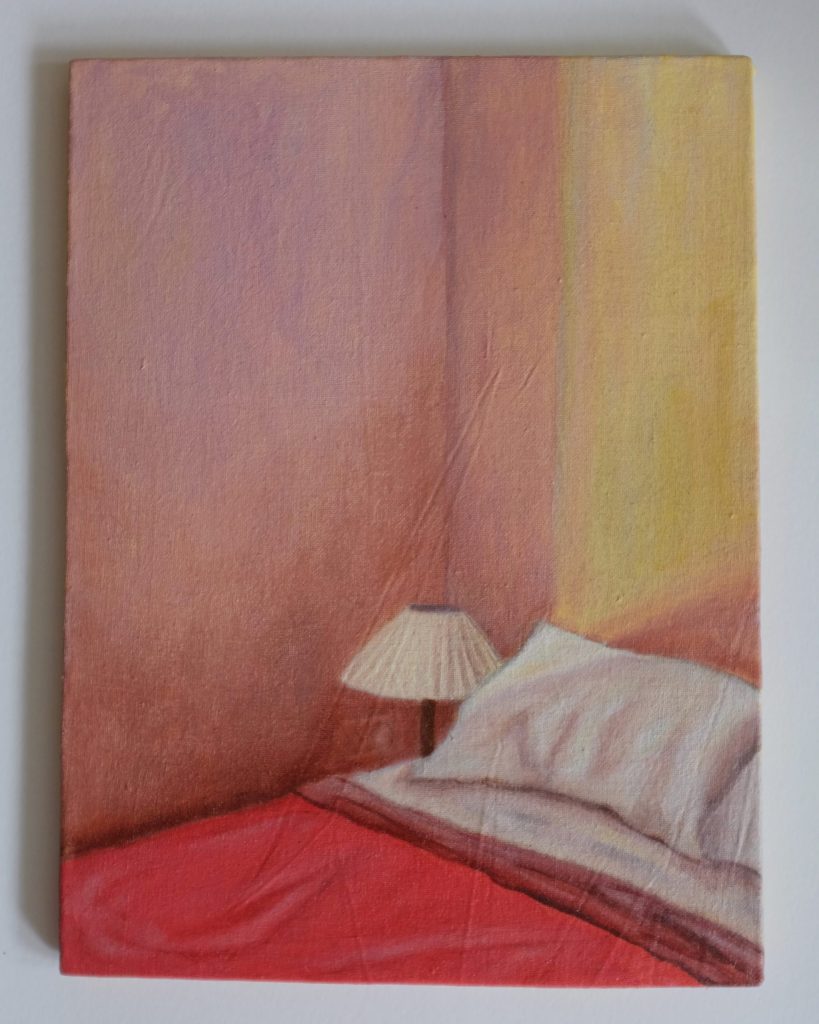 Beth Kaye - Just Us: A painting featuring a bed with white pillows, red covers, and a small lamp against softly lit pink and yellow walls.