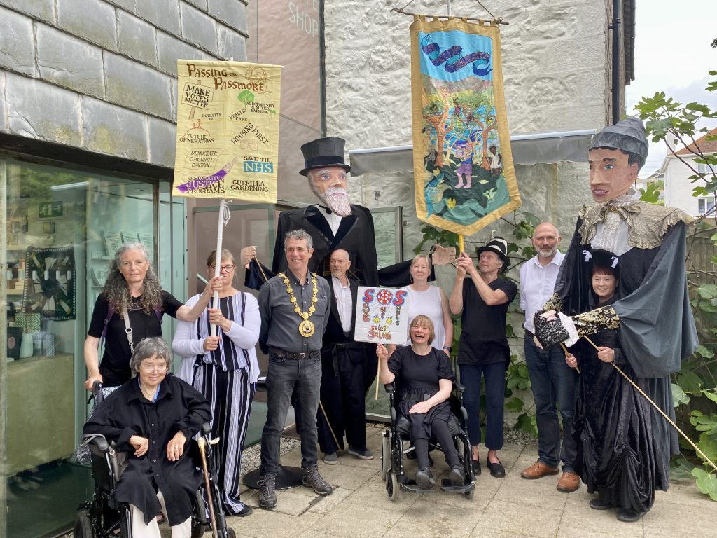 Image shows Shalla Arts group at Newlyn Art Gallery with Passmore edwards pupets and banners