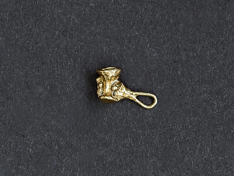 Small Brass Jewellery Charm of hand holding cup.