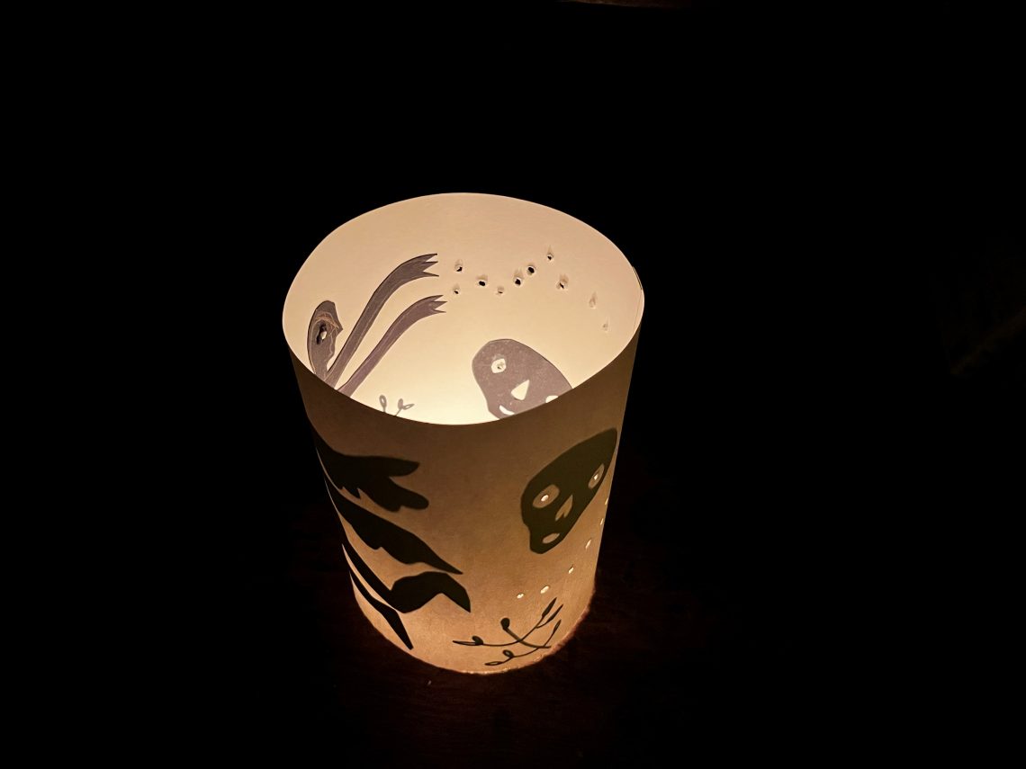 Image shows a cylindrical lantern illuminated from inside