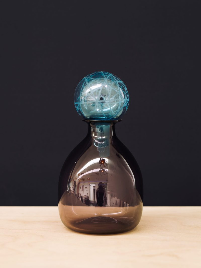 Brown carafe with blue stopper