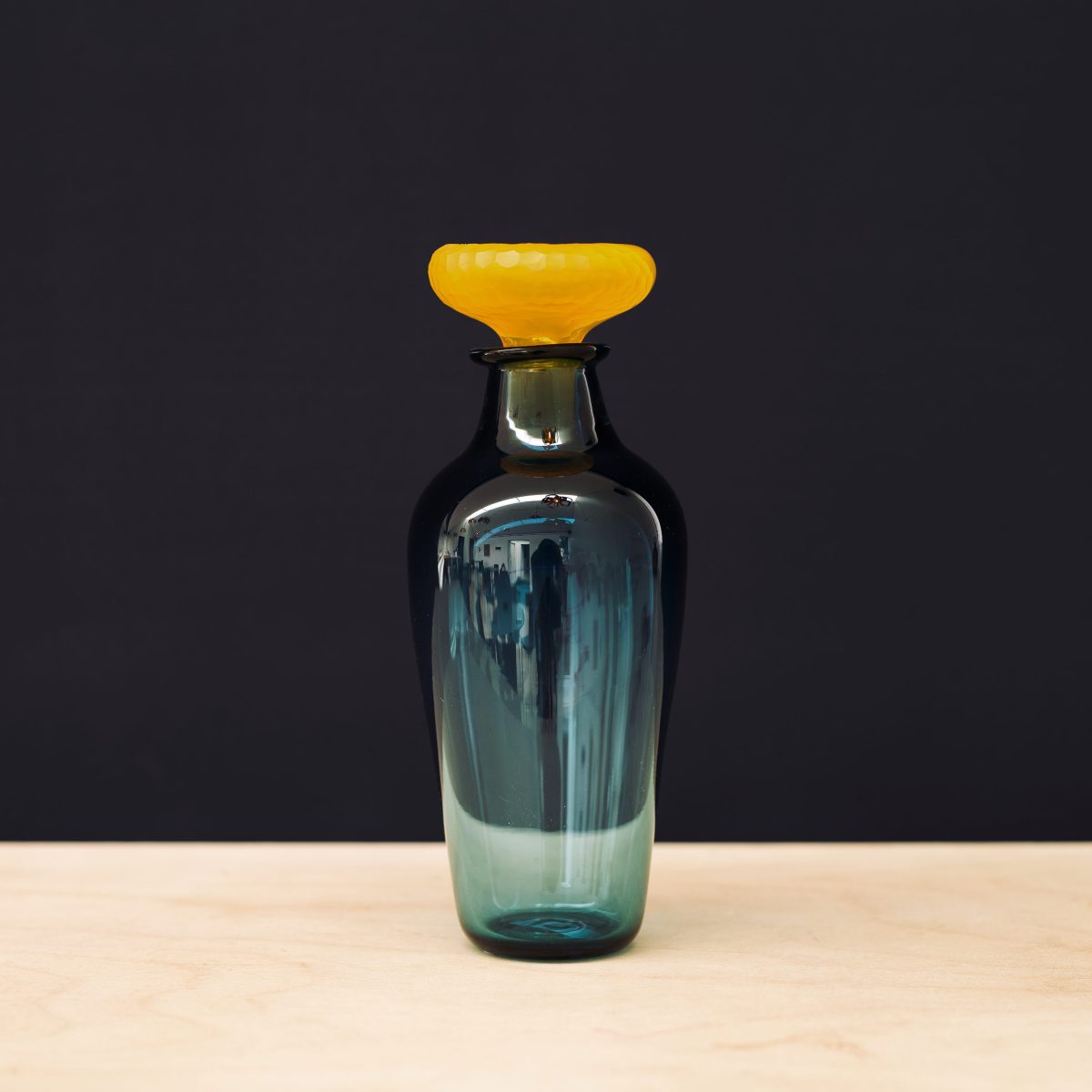 Blue carafe with yellow stopper