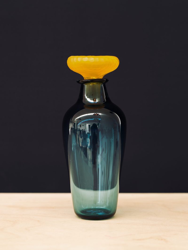 Blue carafe with yellow stopper