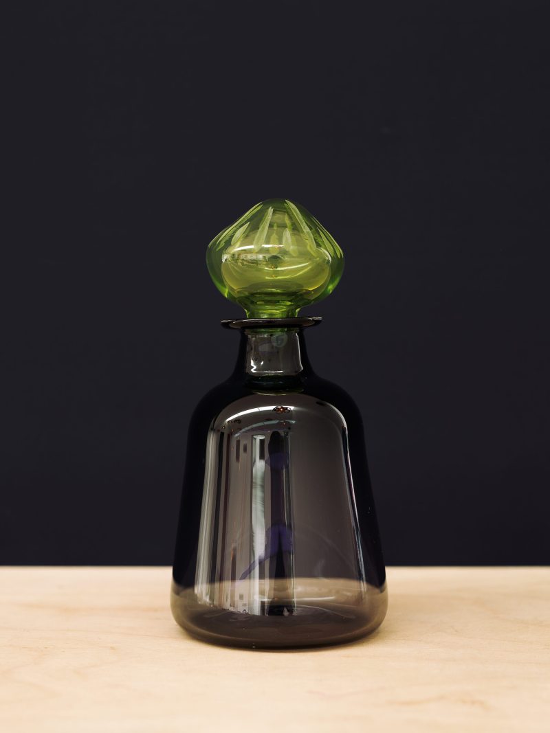 Black carafe with green stopper